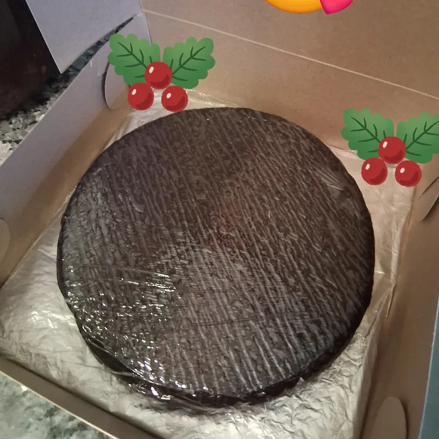 A black cake packed in a gift box